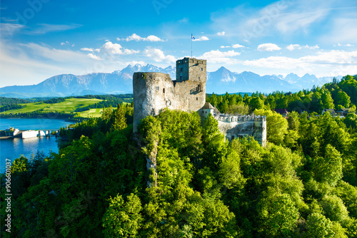 Obraz na płótnie Beautiful view of the castle in Niedzica on a sunny day with the Tatra Mountains in the background, Poland w salonie