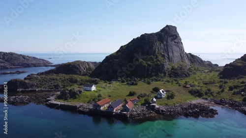 Aerial view of Norwegian fjord landscape in the Lofoten island with wooden cabins in coastal towns in Mortsund