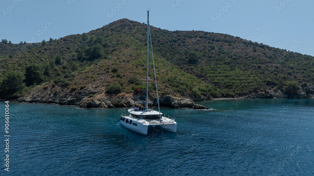 The beauty of a catamaran cruising, seen from above. The beauty of a catamaran cruising, seen from above.