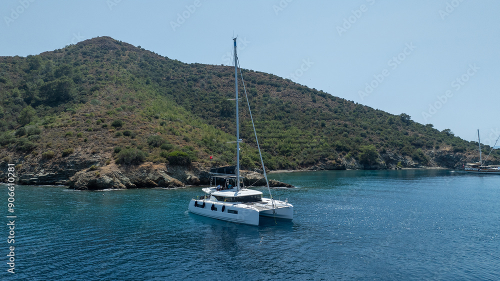 The beauty of a catamaran cruising, seen from above. The beauty of a catamaran cruising, seen from above.