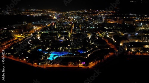 Wallpaper Mural Pan shot flight with panorama of hotel resorts of Playa de las Americas, beach and Atlantic Ocean on Canary Island Tenerife at night, Spain Torontodigital.ca