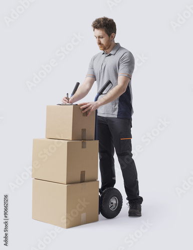 Delivery man checking shipping documents