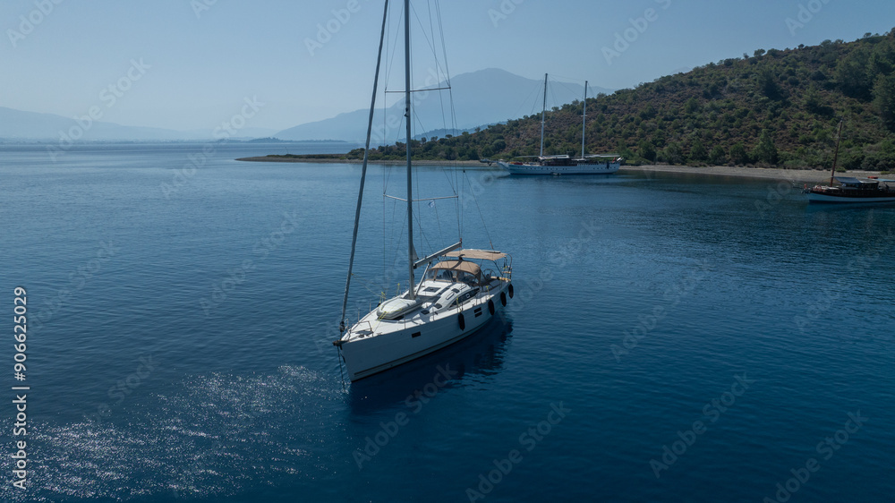The charm of a sailing boat voyage, seen from above. The charm of a sailing boat voyage, seen from above.