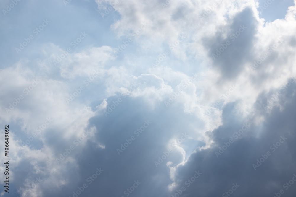 The sky is cloudy and the sun is shining through the clouds The sky is cloudy and the sun is shining through the clouds