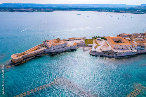 Aerial of Ortigia island, old town with turquoise sea of Syracuse. Small island on Sicily, Italy. photo