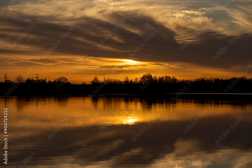 reflection of trees at sunset, river with reflection reflection of trees at sunset, river with reflection