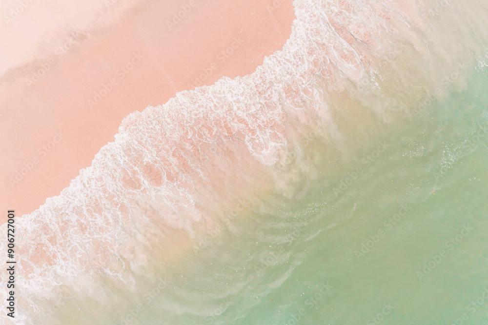 Fototapeta premium empty beach and sea waves seen from above, top aerial view from drone. Summer concept