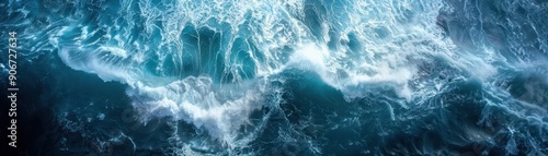 Aerial View of Powerful Ocean Waves Crashing and Creating White Foam in Deep Blue Sea