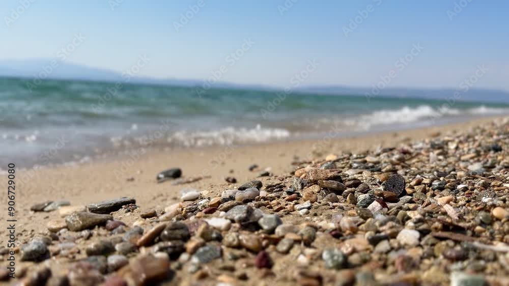 View of sea and sand beach in summer season. Waves on sand and pebbles background. Amazing sea beach with ocean wave foam. Beautiful nature beach sand sea surface, Concept holiday summer Travel Place