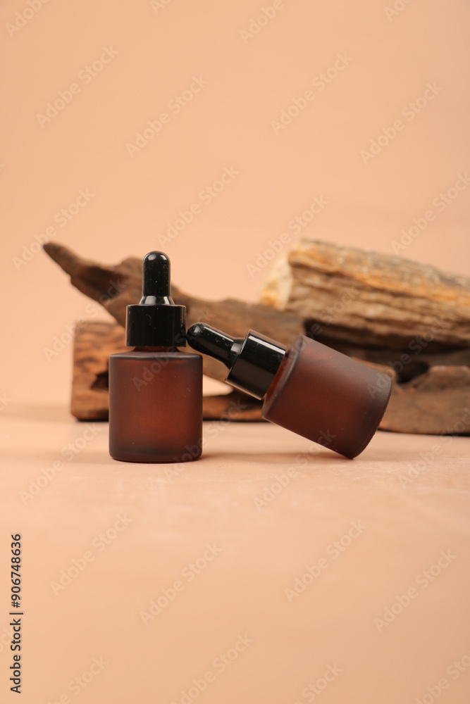 Matte Amber Dropper Bottles on Wood Background Matte Amber Dropper Bottles on Wood Background