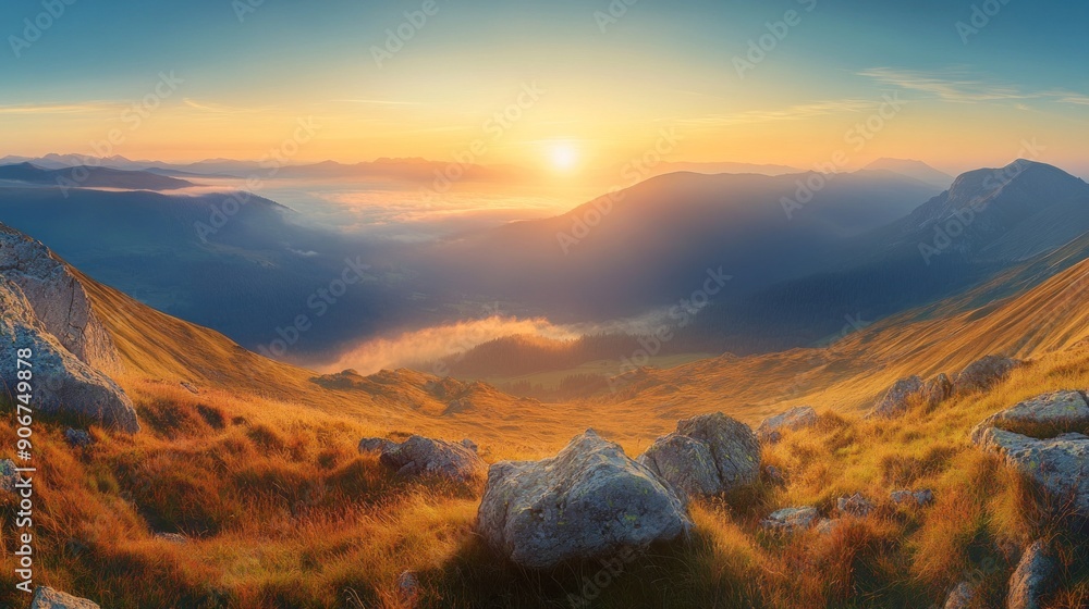 Obraz premium Majestic Mountain Range Sunrise with Fog and Rocks