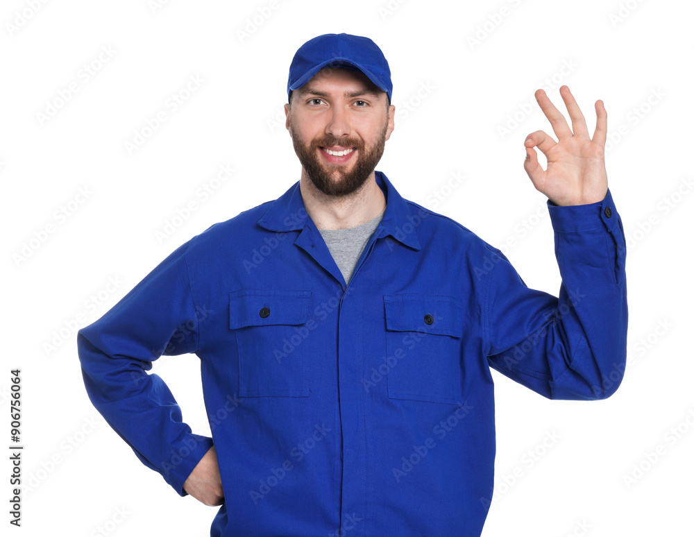 Professional auto mechanic showing OK gesture on white background Professional auto mechanic showing OK gesture on white background