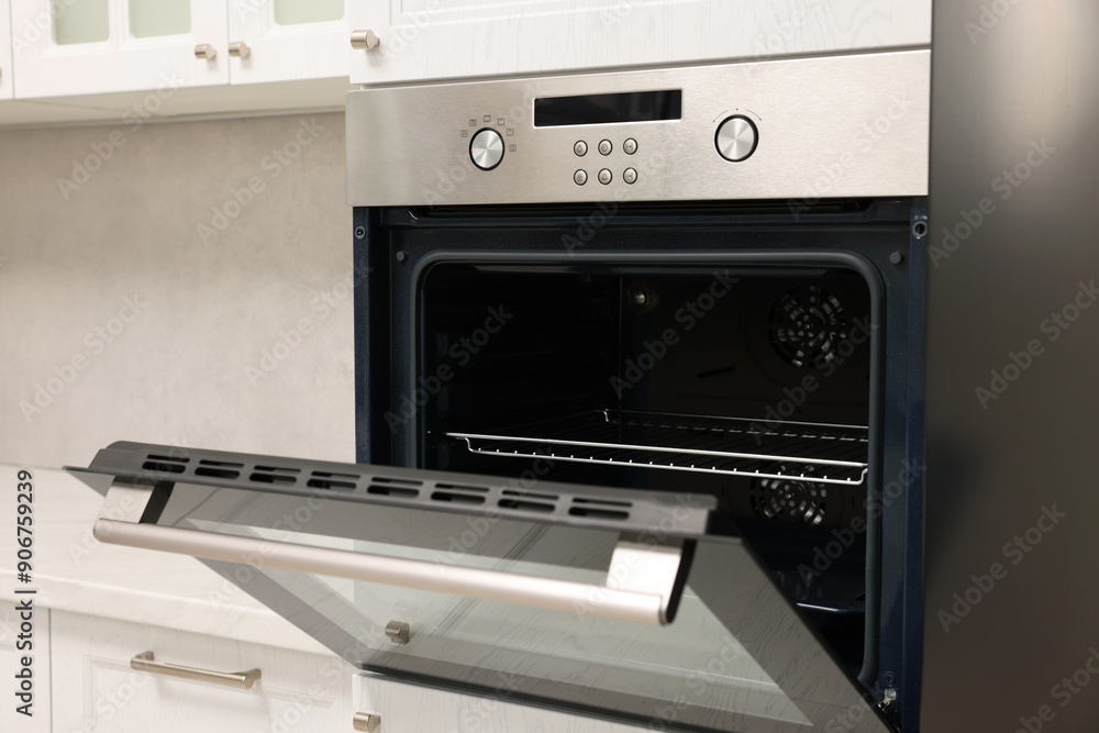 Open electric oven in kitchen. Cooking appliance Open electric oven in kitchen. Cooking appliance