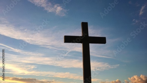 silhouette of the cross symbol against the evening sky background