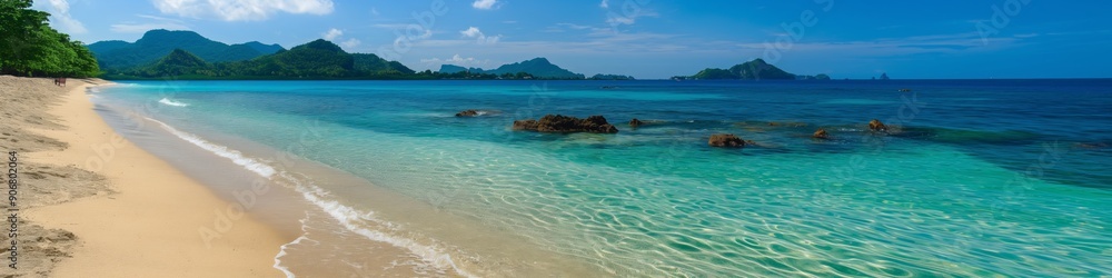 A beautiful beach with a clear blue ocean and a rocky shore. The beach is empty and the water is calm A beautiful beach with a clear blue ocean and a rocky shore. The beach is empty and the water is calm