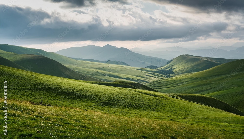 A tranquil highland plateau with expansive views of rolling green fields and distant mountain ranges under a soft, overcast sky.
A tranquil highland plateau with expansive views of rolling green fields and distant mountain ranges under a soft, overcast sky.