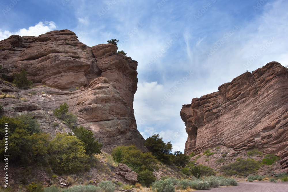 Fototapeta premium Dirt Road Curves Around Sandstone Cliffs