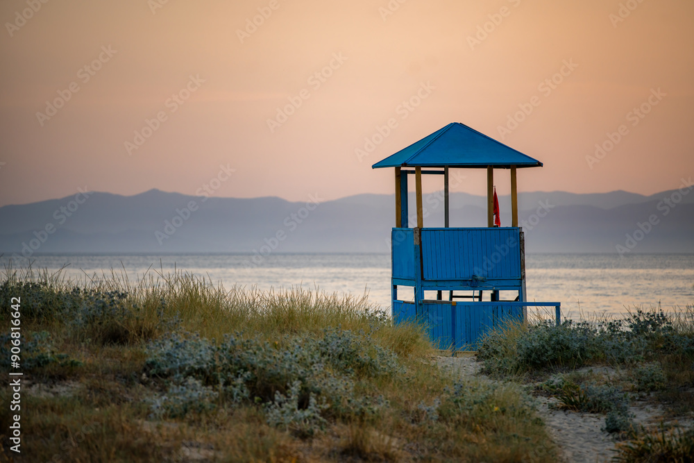 Beach watch tower at sunset on a wild beach, Sardinia, Italy, Mediterranean, Europe Beach watch tower at sunset on a wild beach, Sardinia, Italy, Mediterranean, Europe