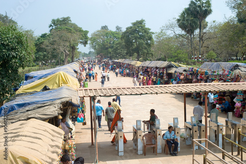 The bazaar in the street leading to the entrance gate to the grounds of the mid-13th century Sun Temple dedicated to the Hindu Sun God, Surya, Konarak, Puri District, Odisha, India, Asia photo