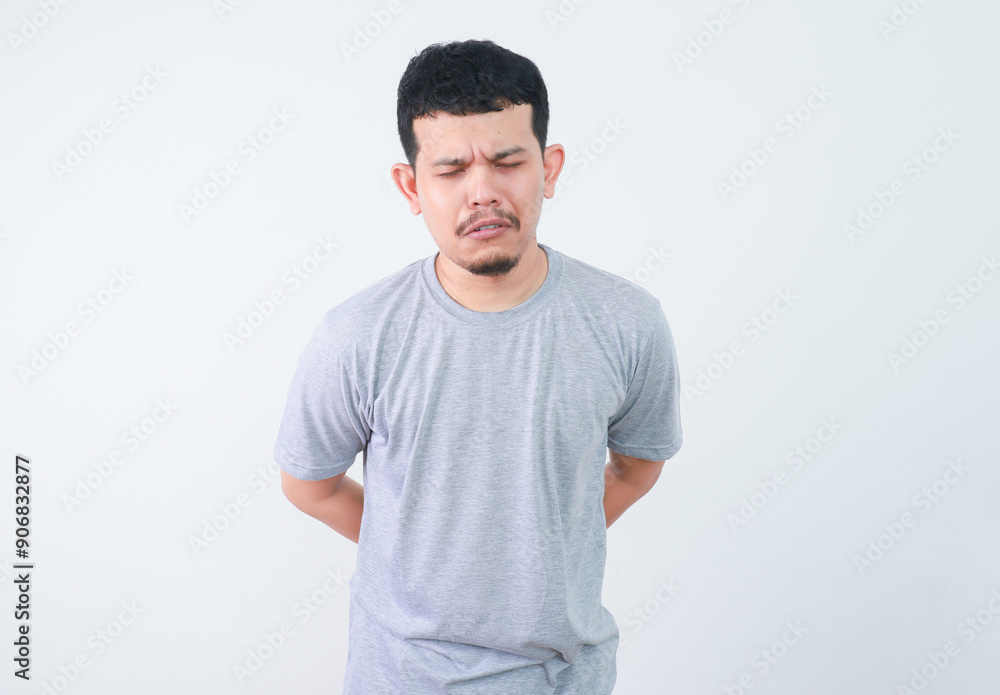 Asian young man crying and showing sad expression Asian young man crying and showing sad expression