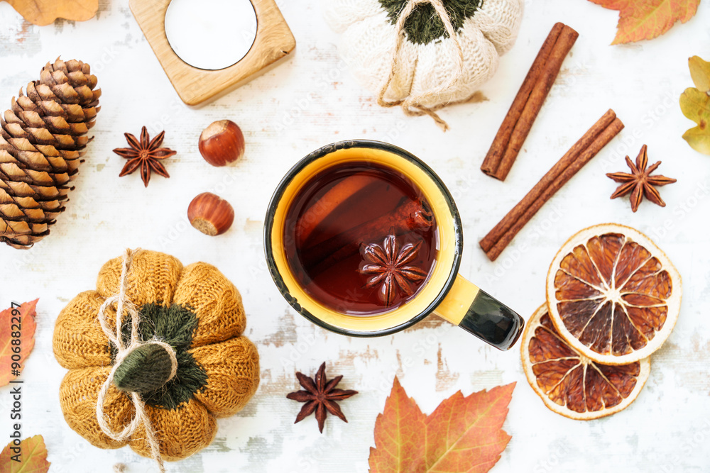 Fall background. Autumn tea, spices, orange leaves, and home decor. Flat lay with copy space. Fall background. Autumn tea, spices, orange leaves, and home decor. Flat lay with copy space.