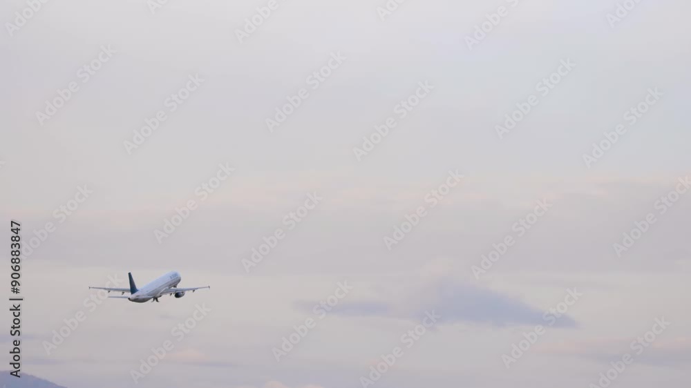 Passenger airplane taking off at Almaty airport. Airplane and mountains background. Flight departure Passenger airplane taking off at Almaty airport. Airplane and mountains background. Flight departure