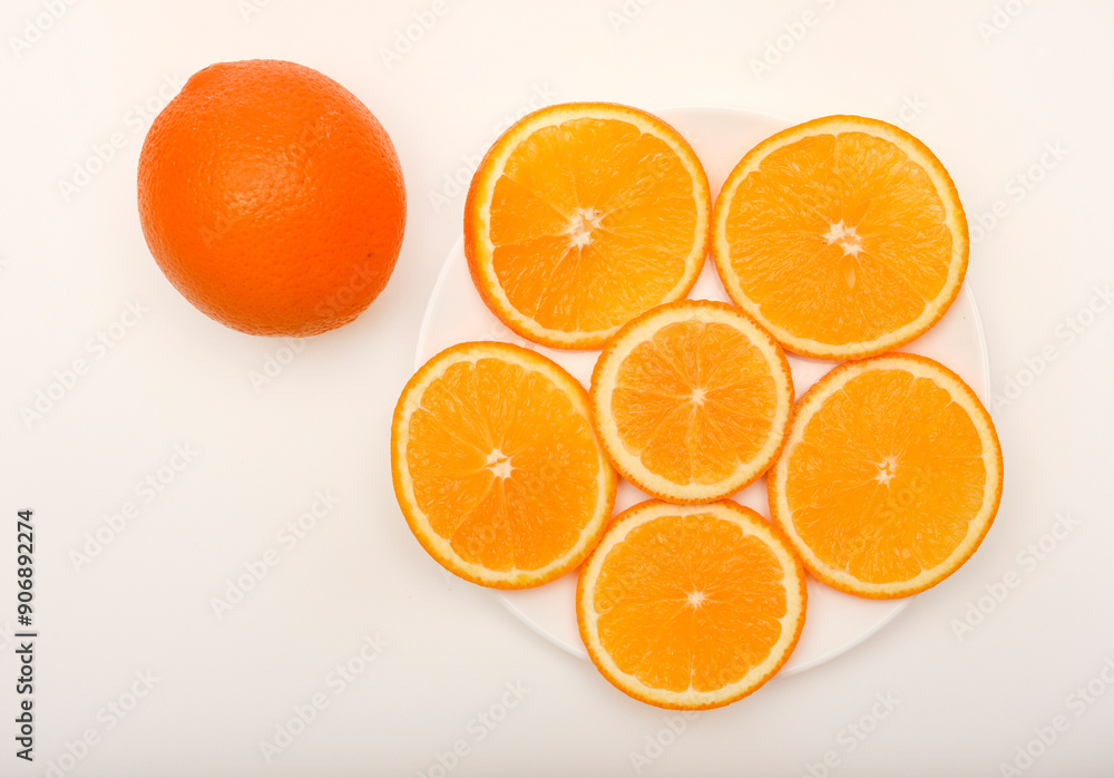 Sliced oranges on a white background. Chopped fruits. Sliced oranges on a white background. Chopped fruits.