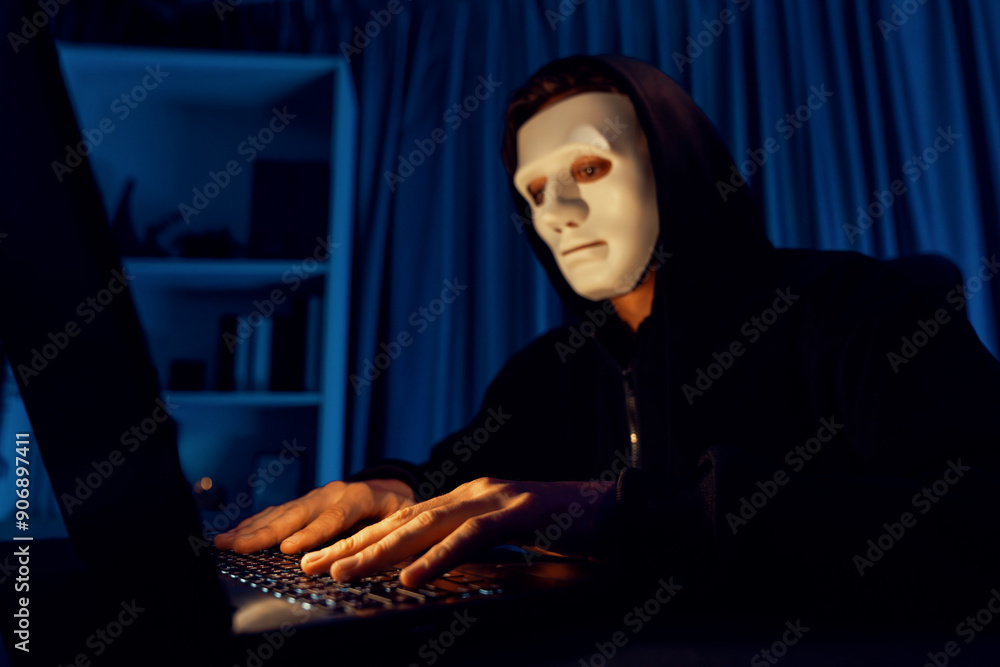 Fotografia do Stock: White criminal anonymous mask installing coding ...