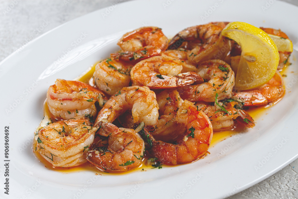 fried tiger prawns, jumbo, in garlic sauce, in butter, with herbs, on a white plate, homemade, no people, fried tiger prawns, jumbo, in garlic sauce, in butter, with herbs, on a white plate, homemade, no people,