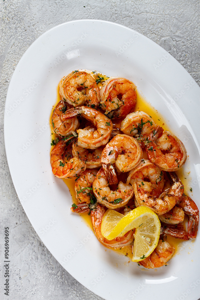 fried tiger prawns, jumbo, in garlic sauce, in butter, with herbs, on a white plate, homemade, no people, fried tiger prawns, jumbo, in garlic sauce, in butter, with herbs, on a white plate, homemade, no people,