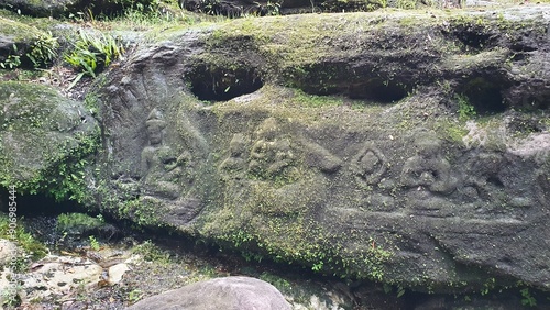 Cambodia. Bas-reliefs in the jungle on Phnom Kulen Mountain in the National Park. Siem Reap province.  photo