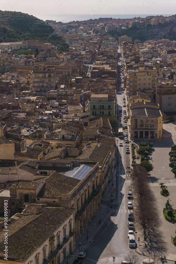 Fototapeta premium Cityscape of small town in mountains on a sunny spring day, Scicli, Sicily, Italy