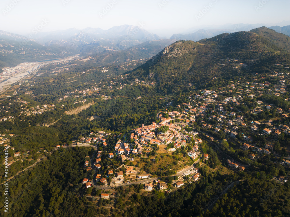 Nice at the foot of the Alpine mountains, photo view from a drone on a summer morning. Nice at the foot of the Alpine mountains, photo view from a drone on a summer morning.