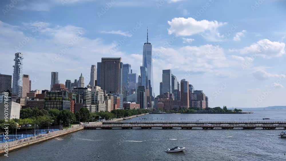nyc downtown skyline timelapse (time lapse of clouds moving behind skyscrapers in new york city) lower manhattan and hudson river boats pier movement passing nyc downtown skyline timelapse (time lapse of clouds moving behind skyscrapers in new york city) lower manhattan and hudson river boats pier movement passing