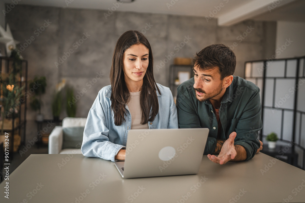adult caucasian couple stand and use, study learn on laptop at home adult caucasian couple stand and use, study learn on laptop at home