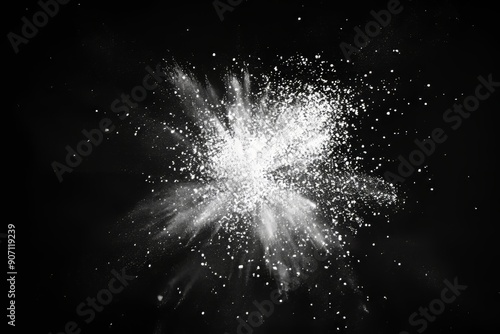 The white spray paint spot on a black background is shown in close-up.