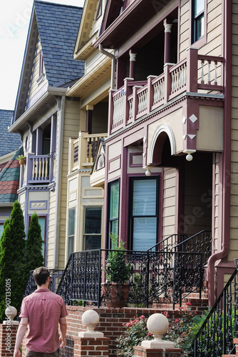 Taking a walk through the neighborhood in front of colorful historic homes in Occoquan, Virginia.  photo