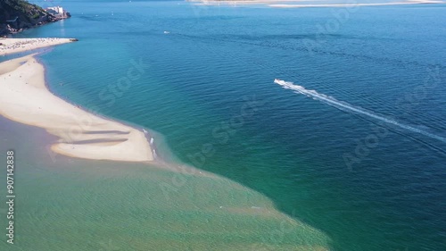 Figueirinha White Sandspit Beach, Boat and Atlantic Ocean. Portugal. Aerial High Angle View. Moving Sideways photo