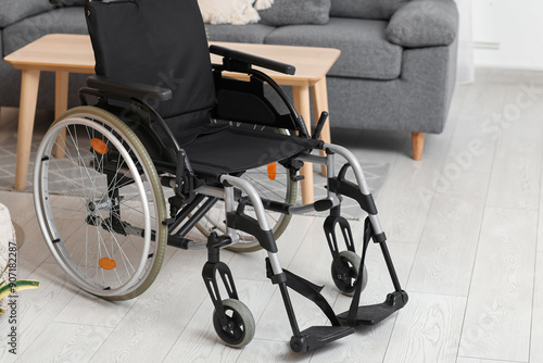 Modern wheelchair in living...