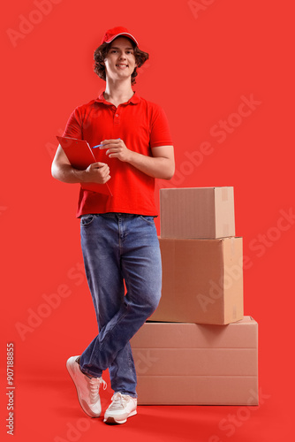 Male courier with cardboard...