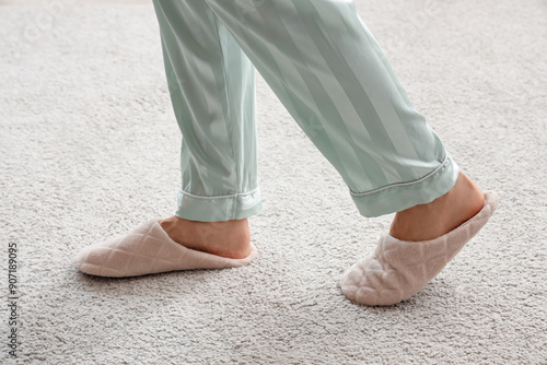 Woman in slippers walking o...