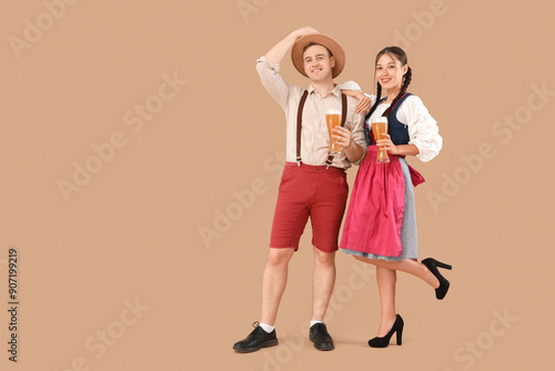 Young happy couple in tradi...