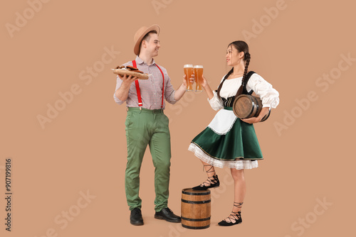 Young happy couple in tradi...