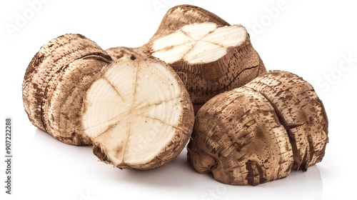 Raw organic eddoe or taro corms cross cuts isolated on white background