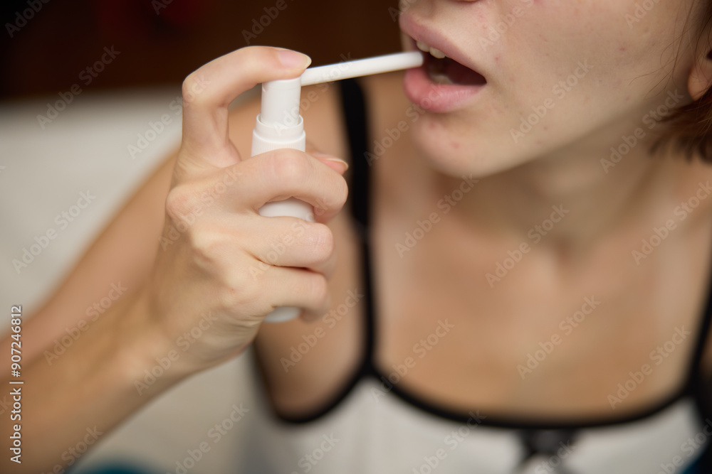 A woman using an electric toothbrush to brush her teeth A woman using an electric toothbrush to brush her teeth