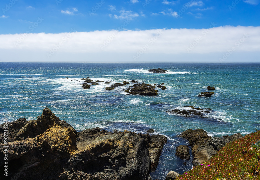 Pigeon Point shoreline with rocks and tide pools in Pescadero at summer time. Pigeon Point shoreline with rocks and tide pools in Pescadero at summer time.