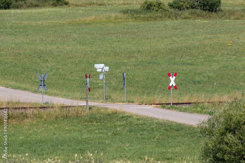 Andreaskreuze an unbeschranktem Bahnübergang photo