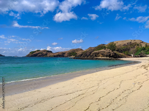 Kuta Lombok has beautiful beaches and surf spots, Kuta Mandalika Beach Lombok, beach with blue sky and clouds, beach in the summer, beach with trees photo