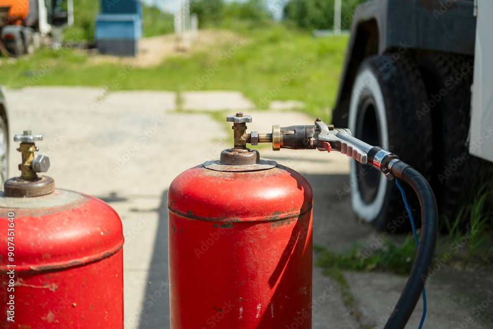 Gas cylinders are connected to a gas supply hose, filled with gas . Gas cylinders are connected to a gas supply hose, filled with gas .