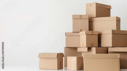 Stacked brown cardboard boxes against a white background with a banner for text, perfect for web design templates related to moving home or delivery services. Captured with a wide-angle lens to emphas photo